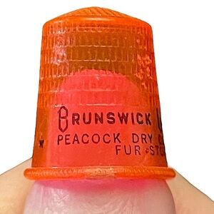 VINTAGE Brunswick Laundry Jersey City Orange Plastic Advertising Thimble